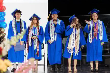 Five Taylion graduates in blue caps and gowns standing on stage, smiling and waving during a graduation ceremony with floral decorations and balloons in the foreground.